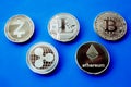 Crypto currency silver coins on a blue background