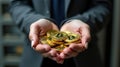Crypto trader investor holding collection of Bitcoin coins