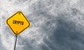 Crypto - yellow sign with cloudy sky