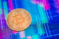 Cryptocurrency Bitcoin coin over tablet screen Royalty Free Stock Photo