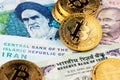 Cryptocurrency Bitcoin with Iranian Rial and Indian Rupee money. Royalty Free Stock Photo