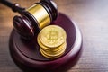 Cryptocurrency. Bitcoin virtual money. Golden coins and judge gavel