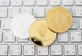 Cryptocurrency coins - Close-up of Litecoin, Bitcoin, Ethereum on the keyboard