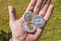Cryptocurrency coins in a hand; Bitcoin, Ripple, Dash Royalty Free Stock Photo