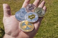 Cryptocurrency coins in a hand; Bitcoin, Ripple, Dash Royalty Free Stock Photo