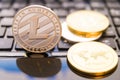 Cryptocurrency coins - Litecoin, Bitcoin, Ethereum, Ripple cryptocurrency concept stock of physical bitcoins gold and silver coins