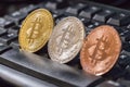 Cryptocurrency coins over black keyboard; Bitcoin coins Royalty Free Stock Photo