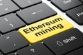 Cryptocurrency concept: Ethereum Mining on computer keyboard background