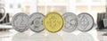 Cryptocurrency. Golden bitcoin and variety of silver virtual coins on blur background, banner, front view. 3d illustration