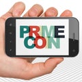 Cryptocurrency concept: Hand Holding Smartphone with Primecoin on display