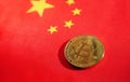 Bitcoin lay on Chinese flag. Royalty Free Stock Photo