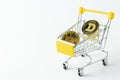Cryptocurrency dogecoin in a shopping cart on a white background in a close-up