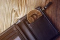 Cryptocurrency dogecoin in a wallet on a wooden background in a close-up top view