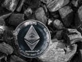 Cryptocurrency eth coin lies on coal. Mining and Energy for mining.