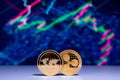 Cryptocurrency Charts with two golden coins