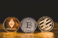 Cryptocurrency litecoin,Silver Bitcoin,Ethereum on golden floor Royalty Free Stock Photo