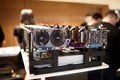 Crypto currency ethereum mining equipment rig - lots of gpu cards on mainboard. Graphics processing units connected to