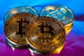 Cryptocurrency physical golden bitcoin coin on colorful background