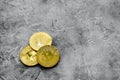 Cryptocurrency physical golden bitcoin coins for changing or selling stone background mock up