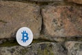 Cryptocurrency physical silver bitcoin on the brick wall