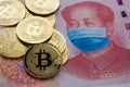 Cryptocurrency restrictions in China after COVID-19 pandemic. Concept. Picture of Bitcoin coins placed on 100 yuan note with