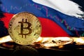 Cryptocurrency standing in front of Blurred Russia flag. Concept of countermeasure against financial sanctions