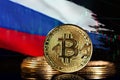 Cryptocurrency standing in front of Blurred Russia flag. Concept of countermeasure against financial sanctions