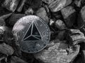 Cryptocurrency trx coin lies on coal. Mining and Energy for mining.
