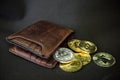 Cryptocurrency wallet, saving and investment concept. Wallet with different crypto coins like bitcoin and ethereum on black Royalty Free Stock Photo