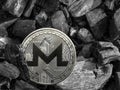 Cryptocurrency xmr coin lies on coal. Mining and Energy for mining.