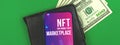 Cryptographic NFT non fungible token marketplace, cryptoart and blockchain logo on the screen of modern mobile phone