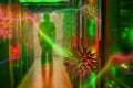 Cryptographic viruses and criminal hacks, the background of server lights and the silhouette of a man Royalty Free Stock Photo