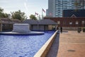 the crypts of Martin Luther King and Coretta Scott King surrounded by a pool of rippling water with blue tile