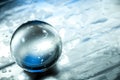 Crystal ball in abstract blue with reflections. Royalty Free Stock Photo