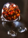 Crystal ball backlit in red on a water surface