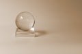 Crystal ball, glass ball. Light beige toning. Interior detail, home design item. Simple shapes Royalty Free Stock Photo