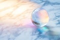 Crystal Ball on Marble Background Pastel Rainbow Light Reflection Royalty Free Stock Photo