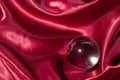 Crystal ball on red silk textile Royalty Free Stock Photo