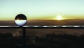 Crystal ball with a reflection of the sunset in it Royalty Free Stock Photo