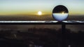 Crystal ball with a reflection of the sunset in it Royalty Free Stock Photo