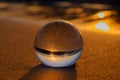 Crystal ball on the sandy beach