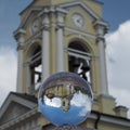 Crystal ball (Spherical lens) and view of the Transfiguration Cathedral. Vyborg Royalty Free Stock Photo