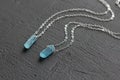 Crystal blue aquamarine beryl on a silver chain. Pendant aquamarine, pendant, decoration on the neck. Natural blue aquamarine on a