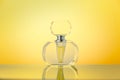 Crystal bottle on yellow gradient background Royalty Free Stock Photo