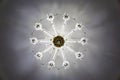 Crystal chandelier on the ceiling, view vertically from the bottom up, pattern, snowflake Royalty Free Stock Photo