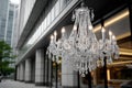 Crystal chandelier hanging outdoors with building backdrop Royalty Free Stock Photo