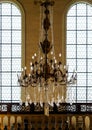 Crystal chandelier lighting in the big majestic hall Royalty Free Stock Photo