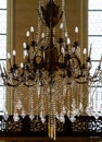 Crystal chandelier lighting in the big majestic hall Royalty Free Stock Photo