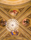 Crystal Chandelier And Painted Church Ceiling.