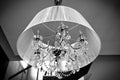 A crystal chandelier with a white shade Royalty Free Stock Photo